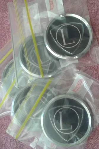 Lancia (NOS) original Lancia wheel centre caps 82279101